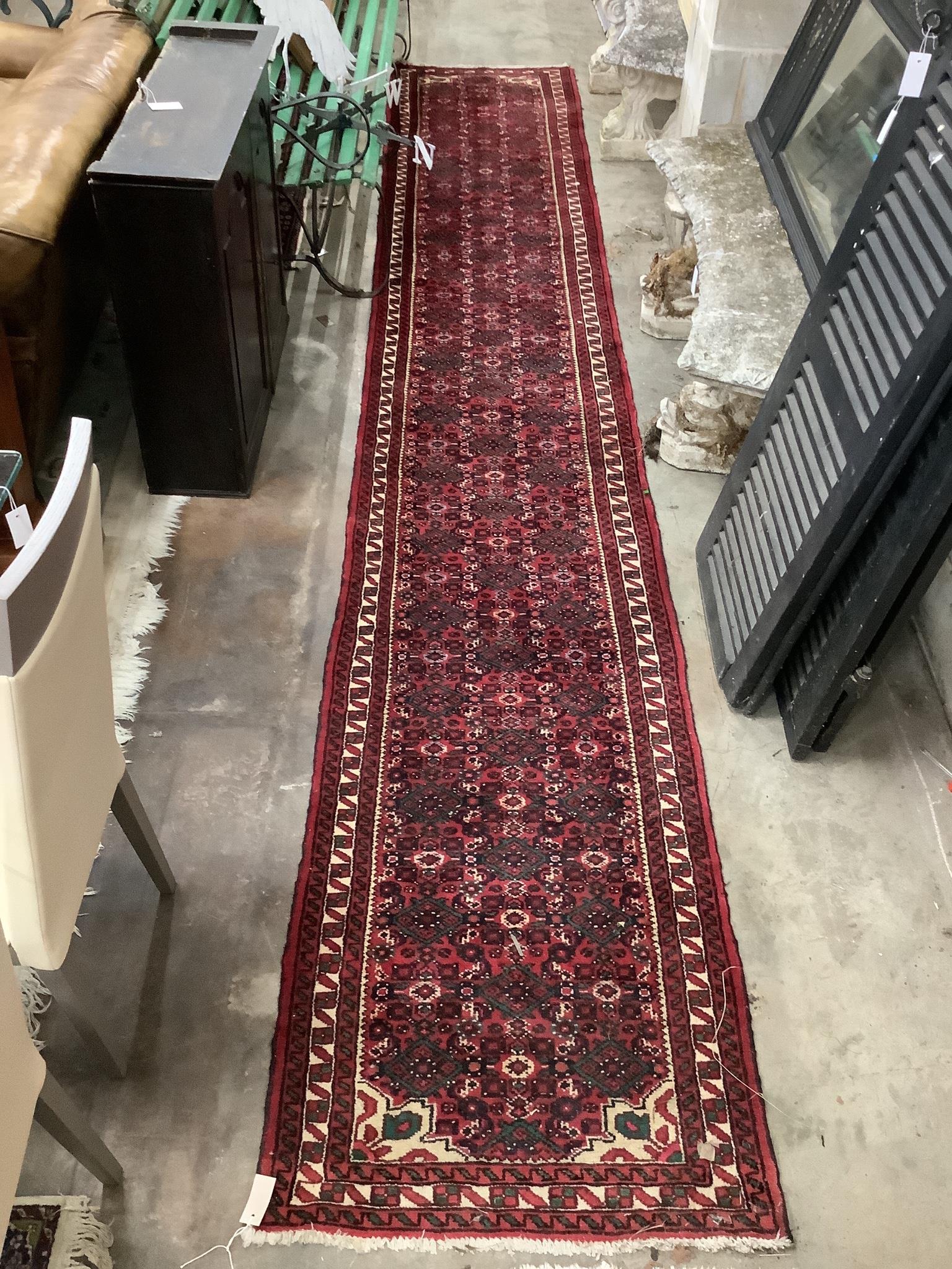 A North West Persian red ground runner, 480 x 80cm